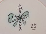 a plate with a bow on it that has writing on it