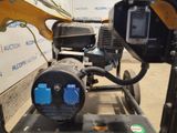 a machine that is sitting on a cart in a warehouse