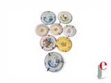 a lot of plates that are sitting on a table