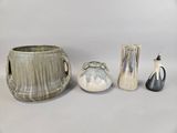 four different vases and a vase on a table