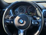 a steering wheel and dashboard of a car on the road