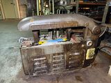 an old machine that is sitting in a garage