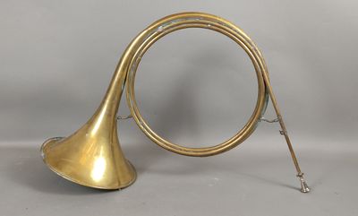 a brass trumpet with a long horn and a long horn