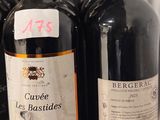several bottles of wine are lined up on a shelf in a store