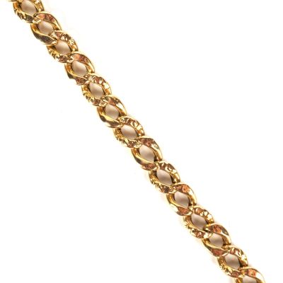 a close up of a gold bracelet on a white background