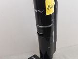a vacuum that is sitting on the floor with a sticker on it