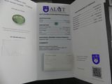 a passport with a picture of a green stone on it