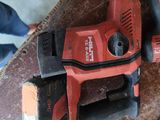 two electric tools that are sitting on a table