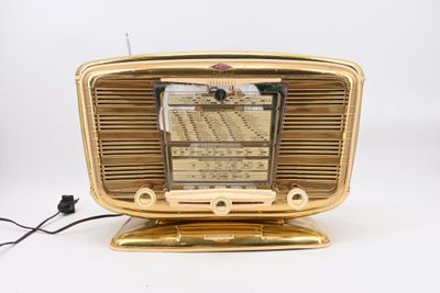 a gold radio that is sitting on top of a table