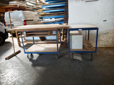 two carts that are sitting next to each other in a garage