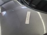 a sticker on the hood of a car with a name on it