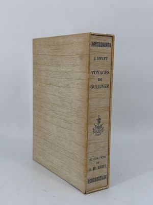 an old book sitting on top of a white surface