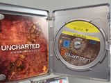 sony uncharted 2 game disc in a case on a table
