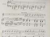 an old sheet of music with notes and symbols on it