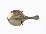 a silver spoon with a handle on a white surface
