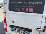 a white van with a pink sticker on the back of it