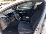 the interior of a car with the door open and the driver ' s seat down