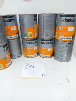 several tins of tins of paint sitting on top of a white table