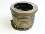 a metal object that is sitting on a white surface