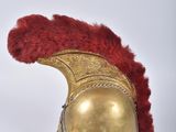 helmet of a roman soldier with red feathers on a white background