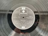 a record with a label on it sitting on a table