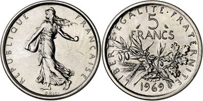 a coin with the image of a woman and flowers on it