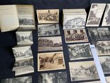 many old black and white photographs on the table