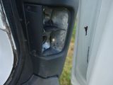 a close up of a car door handle with a hole in it