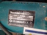 a close up of a blue machine with a tag on it
