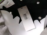 a close up of a bag with a tag on it