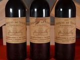 three bottles of wine sitting next to each other on a table