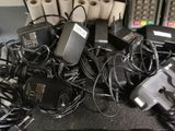 many different types of electronic devices and cords on the table