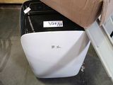 a black and white suitcase sitting on the floor next to a box