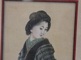 a picture of a woman in a kimono