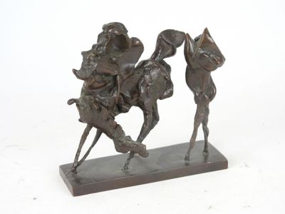 bronze statue of a man riding a horse with a woman on it