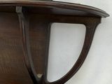 a wooden shelf with a shelf attached to it