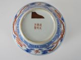 a plate with a picture of a mountain on it