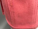 the bottom of a pair of pink slippers with a white sole
