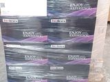 boxes of enjoy experience condoms stacked on a pallet in a warehouse