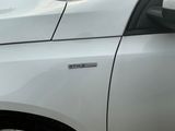 a close up of a car door with a sticker on it