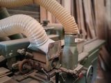 a picture of a machine that is working on a piece of wood