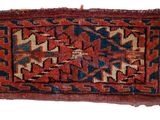 a red and blue rug on a white background