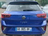 the rear end of a blue volkswagen t - roc parked in a parking lot