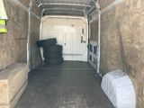 an image of a moving truck with a lot of stuff in the back