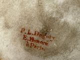 a brown and white bowl with writing on it