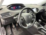 the interior of a car with a steering wheel and dashboard controls