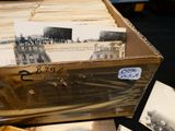 a box full of old black and white photos