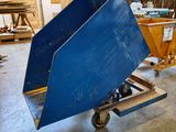 a large blue bin on a dolly in a warehouse