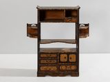 an old wooden shelf with drawers and drawers on it