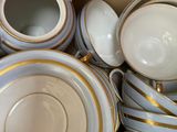 a lot of cups and saucers in a box
